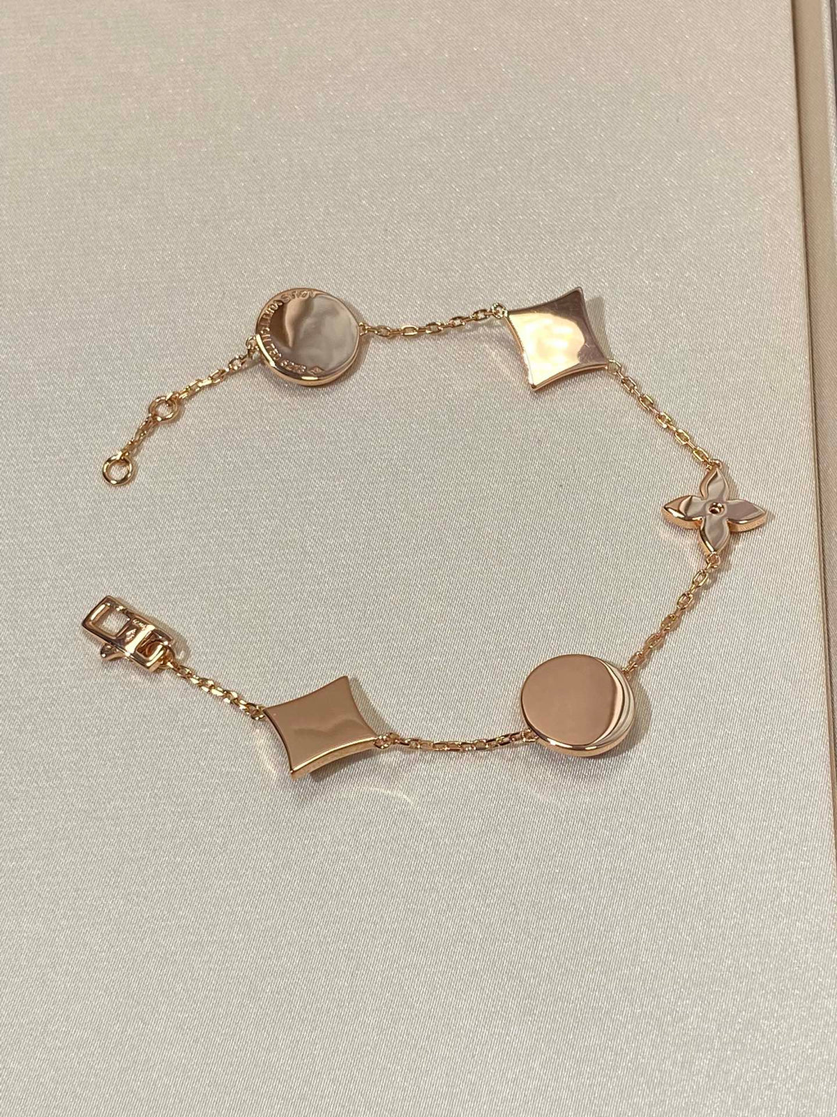 [Sophire Jewelry ]STAR AND SUN 5 MOTIF MOP PINK GOLD BRACELET